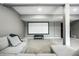 Finished basement featuring home theater setup, comfortable seating, and neutral carpeting at 6771 Woodcliff Cir, Zionsville, IN 46077