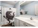 Bathroom with white vanity and a shower with a playful dinosaur-themed shower curtain at 6771 Woodcliff Cir, Zionsville, IN 46077
