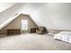Spacious bonus room with neutral carpet, a cozy armchair and plenty of natural light from the window at 6771 Woodcliff Cir, Zionsville, IN 46077