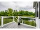Back deck overlooking a scenic water view at 6771 Woodcliff Cir, Zionsville, IN 46077