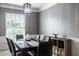 Elegant dining room with a view of a window, dark table, and chandelier at 6771 Woodcliff Cir, Zionsville, IN 46077
