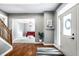 Inviting foyer with wood floors and view of the living room, decorated with modern accents at 6771 Woodcliff Cir, Zionsville, IN 46077