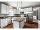 Well-appointed kitchen with white cabinets, stainless appliances, and granite counters is perfect for cooking at 6771 Woodcliff Cir, Zionsville, IN 46077