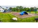 Community playground with modern equipment, lush greenery, and a safe, fun environment for children at 6771 Woodcliff Cir, Zionsville, IN 46077