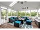 Comfortable screened porch featuring stylish wicker seating and scenic views, perfect for relaxation at 6771 Woodcliff Cir, Zionsville, IN 46077