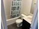 Bathroom with decorative shower curtain, toilet, and vanity at 6926 Trey Dr, Indianapolis, IN 46113