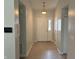Bright entryway with neutral paint and hardwood flooring at 6926 Trey Dr, Indianapolis, IN 46113