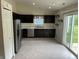Kitchen featuring stainless steel appliances and sliding glass doors at 6926 Trey Dr, Indianapolis, IN 46113