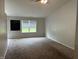 Spacious living room with carpeted floors and natural lighting at 6926 Trey Dr, Indianapolis, IN 46113
