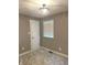 Cozy bedroom offering plush carpet, a window for natural light, and a modern light fixture at 712 W Main St, Thorntown, IN 46071