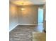 Dining room area with modern lighting, hard surface floors, and neutral colored walls at 712 W Main St, Thorntown, IN 46071