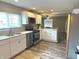Bright kitchen featuring stainless steel appliances, white cabinets and modern fixtures at 712 W Main St, Thorntown, IN 46071
