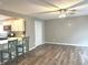 Open concept living room featuring sleek hard surface floors and a ceiling fan at 712 W Main St, Thorntown, IN 46071