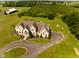 Estate home boasts impeccable landscaping, circular driveway, and mature trees at 7493 W Lane Rd, McCordsville, IN 46055