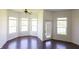 Bright breakfast nook featuring a ceiling fan, multiple windows, and a door leading to the exterior at 7493 W Lane Rd, McCordsville, IN 46055