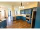 Modern kitchen featuring stylish blue cabinets, stainless steel appliances, and elegant countertops at 7493 W Lane Rd, McCordsville, IN 46055