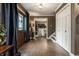 Inviting foyer with brick floors, elegant decor, and a view into adjoining rooms at 7743 Camelback Dr, Indianapolis, IN 46250