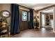 Inviting foyer with brick floors, elegant decor, and a view into adjoining rooms at 7743 Camelback Dr, Indianapolis, IN 46250
