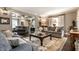 Comfortable living room with stylish furnishings, coffered ceiling, hardwood floors, and neutral tones at 7743 Camelback Dr, Indianapolis, IN 46250