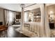 Beautiful main bedroom suite with a four-poster bed, soft lighting, and hardwood floors at 7743 Camelback Dr, Indianapolis, IN 46250