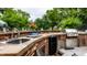Outdoor kitchen featuring a sink, grill, mini fridge, and ample countertop space at 7743 Camelback Dr, Indianapolis, IN 46250