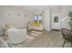Bright living room with light walls, wood floors, lots of natural light, and stylish neutral furniture at 8568 Goldfinch Rd, Brownsburg, IN 46112