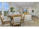 Open-concept living space with a dining area that connects to a cozy living room with comfortable seating at 8568 Goldfinch Rd, Brownsburg, IN 46112