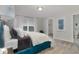 Cozy bedroom with plush carpeting, soft, light-toned walls, and natural light coming in from a window at 8568 Goldfinch Rd, Brownsburg, IN 46112