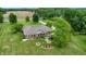 A bird's-eye view of the property featuring a patio with outdoor seating and well-maintained greenery at 8818 Mathews Rd, Indianapolis, IN 46259
