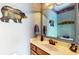Rustic-themed powder room featuring woodsy decor and a marble-look vanity at 8818 Mathews Rd, Indianapolis, IN 46259