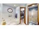 The bathroom has an octagonal window and adjoins a walk-in closet at 8818 Mathews Rd, Indianapolis, IN 46259