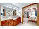 A double vanity, granite counters, and a bedroom with trey ceilings at 8818 Mathews Rd, Indianapolis, IN 46259