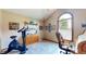 Bedroom used as an office featuring elliptical exercise machine at 8818 Mathews Rd, Indianapolis, IN 46259