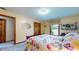 Bedroom featuring floral bedspread and window with cheerful curtains at 8818 Mathews Rd, Indianapolis, IN 46259