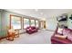 Inviting bonus room featuring neutral colored walls, a view of the outdoors, and comfortable seating at 8818 Mathews Rd, Indianapolis, IN 46259