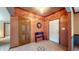 Welcoming foyer with tile flooring, wooden accents, a bench, and two entry doors at 8818 Mathews Rd, Indianapolis, IN 46259