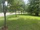 View of the front lawn of the property with tree coverage at 8875 N Goat Hollow Rd, Mooresville, IN 46158