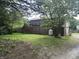 Outbuilding featuring metal siding, a propane tank, and a yard at 8875 N Goat Hollow Rd, Mooresville, IN 46158