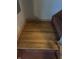 Hardwood flooring on landing with visible grain and texture, with carpet on stairs at 8875 N Goat Hollow Rd, Mooresville, IN 46158
