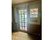 Sun room with hardwood flooring and a glass door leading to the patio at 8875 N Goat Hollow Rd, Mooresville, IN 46158