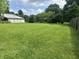 Expansive yard with lush green grass and an outbuilding on the property at 8875 N Goat Hollow Rd, Mooresville, IN 46158