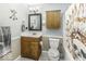 Well-lit bathroom with a sink vanity, toilet, mirror, overhead cabinet and a decorative shower curtain at 911 Centennial Rd, Martinsville, IN 46151