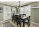 An eat-in dining room area features a table, chairs, and natural light from the windows at 911 Centennial Rd, Martinsville, IN 46151
