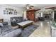 Comfortable living room with hardwood floors, a ceiling fan, neutral decor, and an open floorplan at 911 Centennial Rd, Martinsville, IN 46151