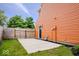 Spacious backyard showcasing a concrete patio area bordered by a privacy fence at 9385 Helmsdale Dr, Indianapolis, IN 46256