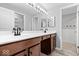 Bathroom features a double sink vanity with modern fixtures and a tiled shower at 9385 Helmsdale Dr, Indianapolis, IN 46256