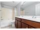 A clean bathroom featuring a bathtub and shower combination with a double sink vanity at 9385 Helmsdale Dr, Indianapolis, IN 46256