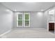 Bright bedroom with plush carpet, light grey walls, double windows, and ample natural light at 9385 Helmsdale Dr, Indianapolis, IN 46256