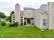Spacious backyard with a well-manicured lawn and covered patio area at 9477 Aberdare N Dr, Indianapolis, IN 46250