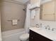 A clean bathroom features a shower/tub, toilet, vanity, and tile floor at 9477 Aberdare N Dr, Indianapolis, IN 46250